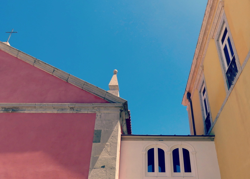 spirituality, architecture, facade, clear sky, travel, outdoors, religion, sunlight, historic center, city, historically, sky, wall, window, color, built structure