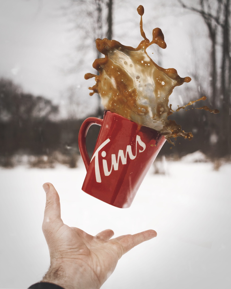 heart shape, outdoors, winter, human body part, red, positive emotion, mug, close-up, tims, one person, deer, focus on foreground, human hand, christmas ornament