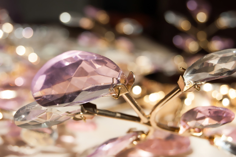 large group of objects, purple, glass - material, table, shiny background, focus, shiny, diamond - gemstone, selective focus, wealth, fashion, silver colored