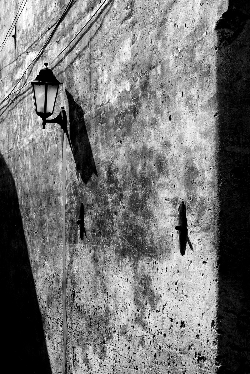 low angle view, built structure, ruined, shadow, damaged, old, outdoors, electric lamp, 4K, street light, lighting equipment, window, architecture, no people
