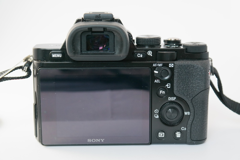 cut out, display, slr camera, lens - optical instrument, electrical equipment, photograph, studio shot, digicam, photo camera, photographer, technology