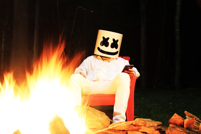 real people, music producer, mask, fire, Others, full length, sitting, leisure activity, mask - disguise, fire - natural phenomenon, night, marshmello