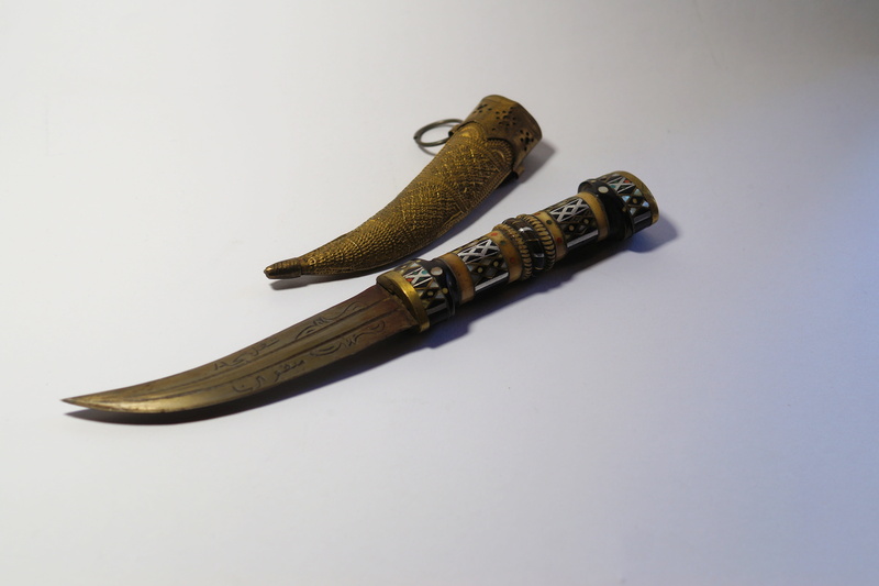 oriental, handmade, animal themes, weapon, 5K, still life, brass, metal, copy space, white background, food, single object, close-up, kukri, no people