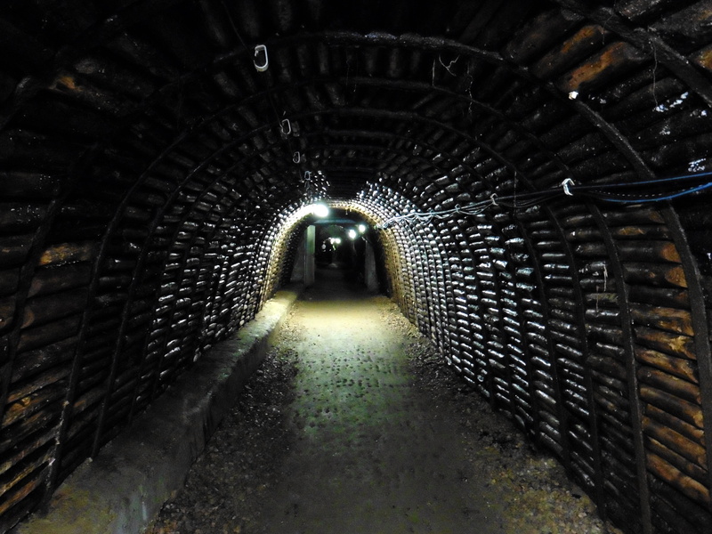 light, architecture, indoors, tunnel, concrete, direction, rock, built structure, diminishing perspective, absence, mine devil reason, light at the end of the tunnel