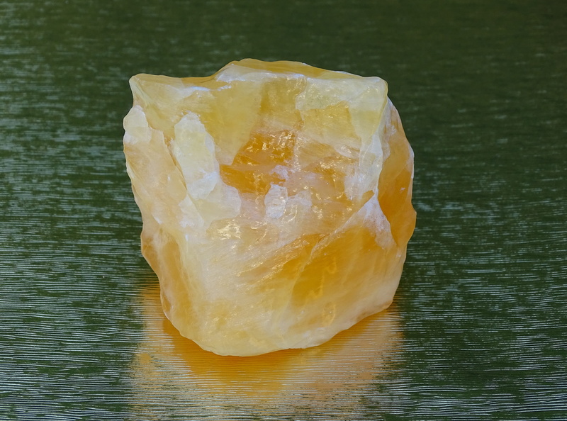 textured, healthy eating, wellbeing, orange, semi precious stone, healing stone, no people, table, natural stone, rough stone, still life, focus on foreground