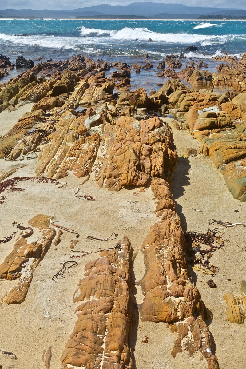 beach, rock - object, landscape, day, nature, rock formation, outdoors, tranquility, layer, rocks, water, tranquil scene, land, eroded, high angle view