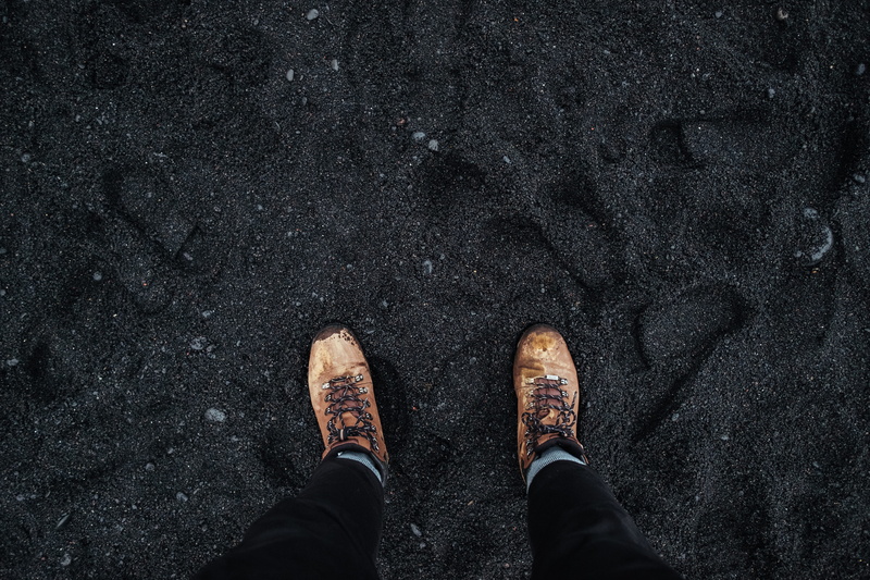 shoes, human body part, personal perspective, city, black, stepping, standing, lifestyles, volcanic, boots, low, high angle view, street, wearing, shoe