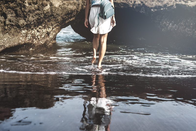 person, holiday, sunset, waterfront, action, cave, female, adult, sand, ocean, sea, vacations, 5K, outdoor, beach, beautiful, black sand, volcanic, nature