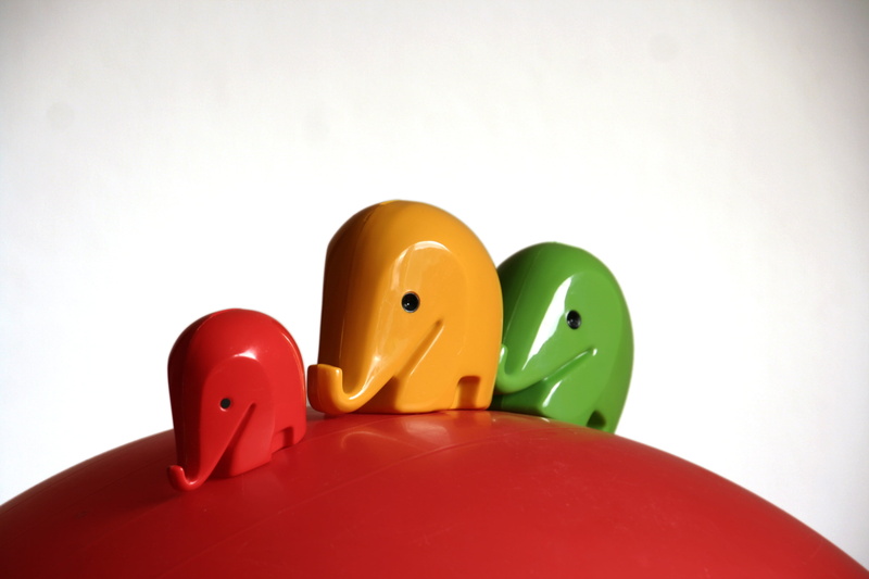 surface, childhood, yellow, variation, plastic, human representation, close-up, indoors, studio shot, money, toy, elephant, choice, white background, anthropomorphic smiley face