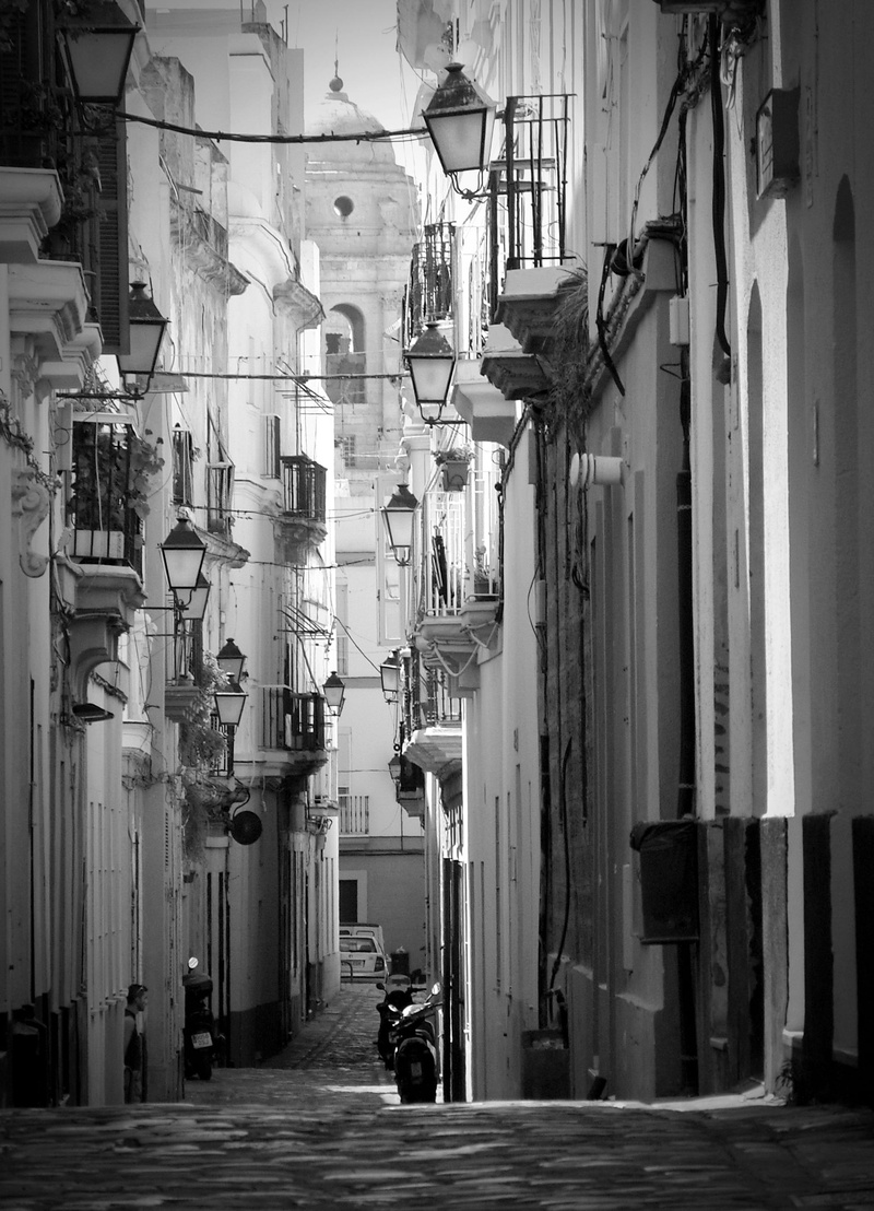 houses, incidental people, city, real people, day, direction, alley, building, one person, residential district, historic center, built structure, facade