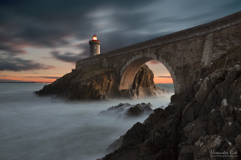 building, nature, sunset, rock - object, power in nature, lighthouse, bridge, built structure, guidance, beauty in nature, sky, building exterior, scenics - nature