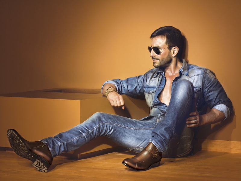 lifestyles, Glasses, Style, leather jacket, hardwood floor, Celebrity, home interior, wood, sunglasses, young adult, wall - building feature, indoors, sitting