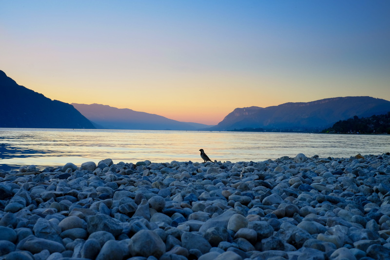 sky, real people, space, mountains, sea, 4K, lake, outdoors, pebble, solid, beach, rocks, rock, nature, land, one person, france, beauty in nature, bird