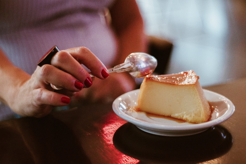 food and drink, adult, person, holding, human hand, table, breakfast, indoors, midsection, dessert, meal, cake, food, women, focus on foreground, hand