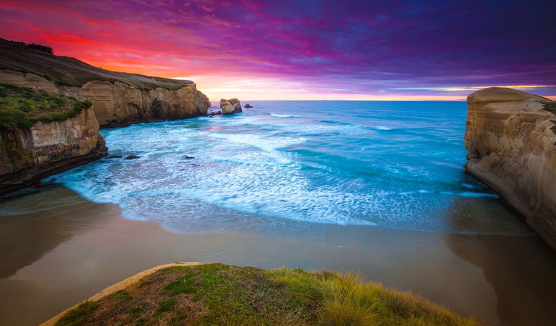 tranquil scene, cliff, sea, sunset, horizon over water, rock - object, beauty in nature, rock, blue, coast, solid, motion, beach, scenics - nature, sky