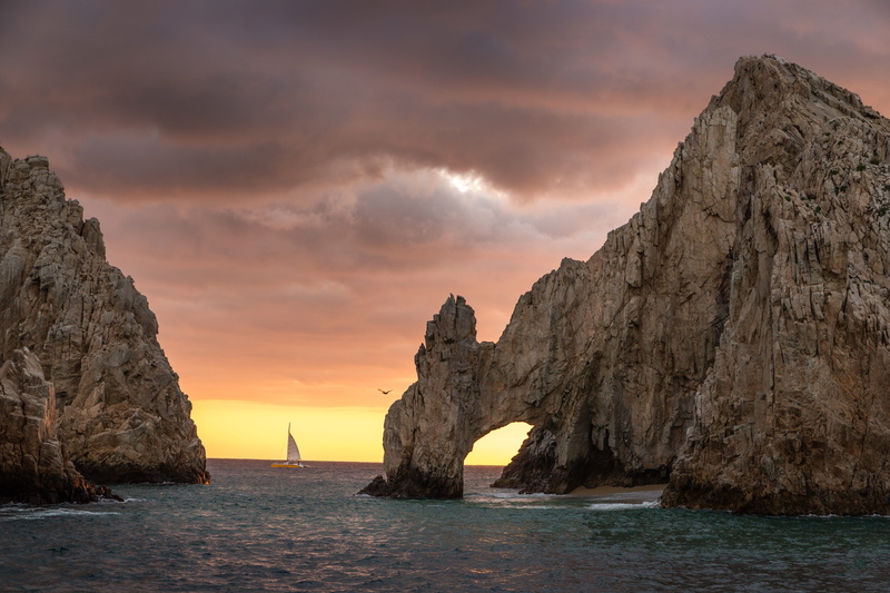 arch, beauty in nature, tranquil scene, sky, sunset, outdoors, clouds, water, scenic, cloud - sky, los cabos, solid, nature, geology, stack rock, idyllic
