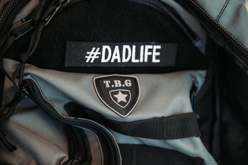 bag, strap, military, accessory, accessories, briefcase, textile, backpack, security, harness, lens cap, text, emblem, digital camera, jeans, camera lens