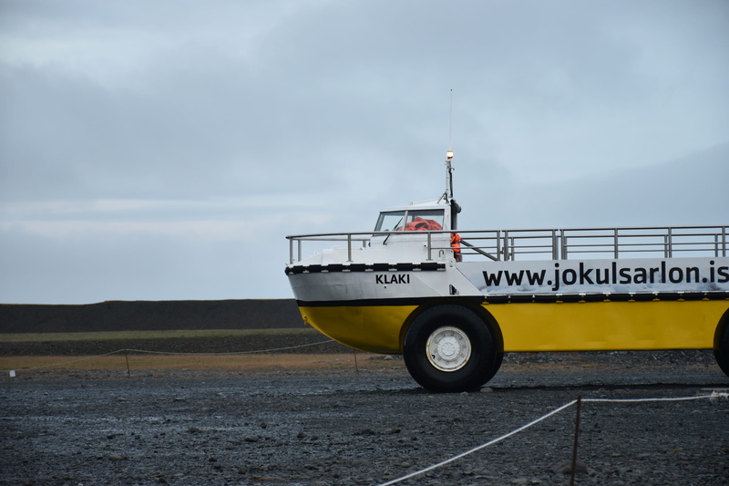 watercraft, ferry, safety, field, tire, boat, no people, sign, vessel, yellow, nautical vessel, military, coast guard, spoke, nature, car wheel, machine