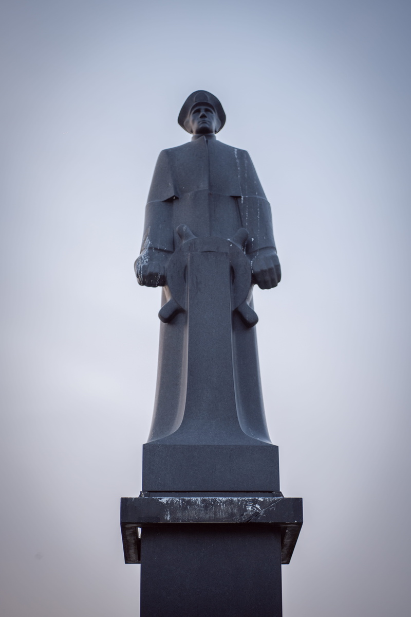 transportation, airliner, low angle view, human, tomb, religion, creativity, clear sky, symbol, norway, craft, nature, spirituality, bergen, male likeness