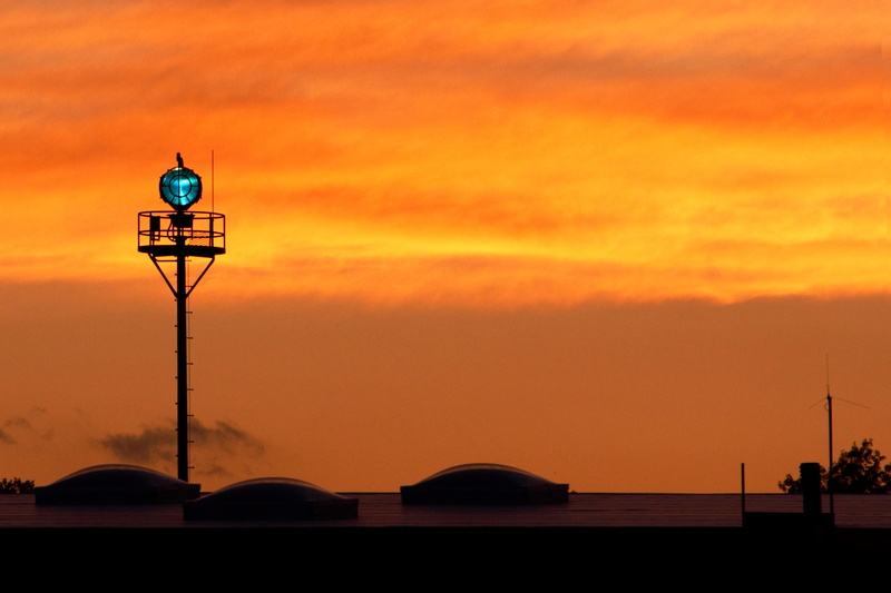 silhouette, beacon, orange color, runway, electric lamp, nature, cloud - sky, lighting equipment, dusk, airport, architecture, general aviation, travel