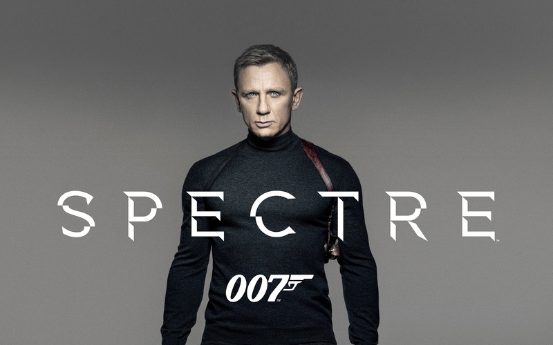 standing, clothing, gray, bond, looking at camera, one person, movie, poster, casual clothing, front view, portrait, 007, western script, lifestyles, adult