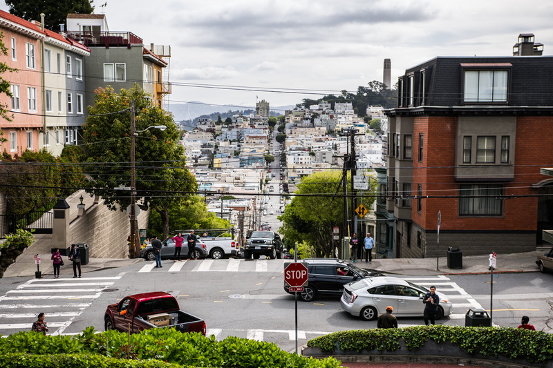 city, downtown, united states, architecture, incidental people, sign, tree, green, outdoors, plant, motor vehicle, cloudy, car, building, city street, city life
