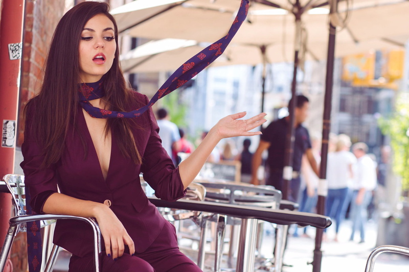 open mouth, singer, depth of field, long hair, purple clothing, women, 1080P, street, wind, sitting, city, Victoria Justice, brunette, actress