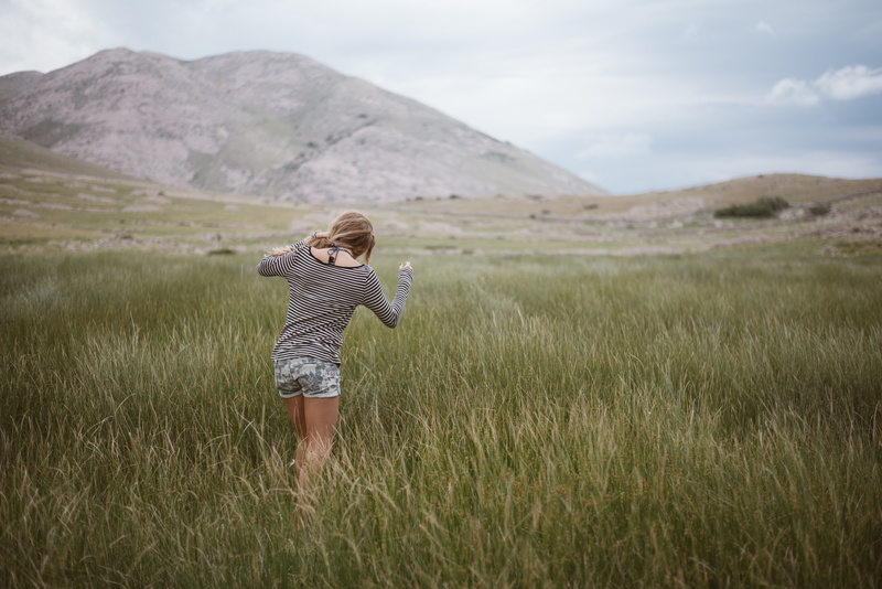 5K, daytime, beauty in nature, alone, travel, woman, shirt, green, shorts, day, clouds, hiking, girl, full length, grassland, leisure activity, people
