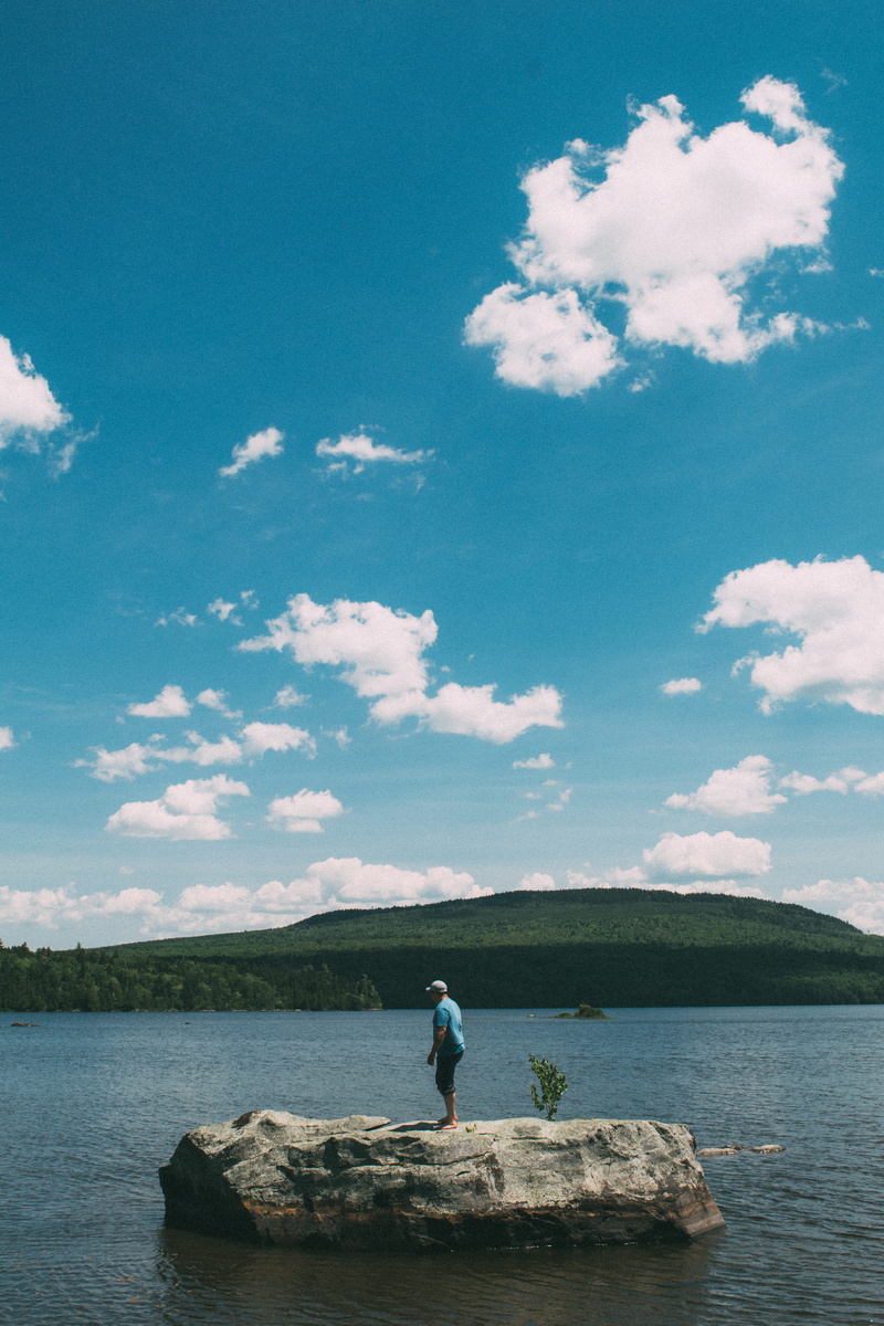 sitting, maine, sky, outdoors, 5K, water, one person, united states, lake, nature, solid, scenics - nature, cloud - sky, rock - object, leisure activity
