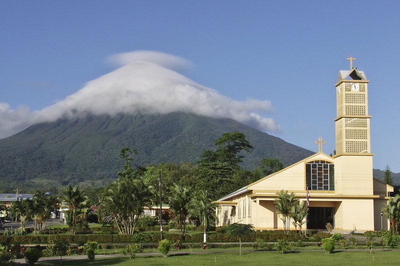 religion, building, place of worship, costa rica, sky, plant, belief, no people, nature, mountain, volcano, cloud - sky, travel destinations, tree, fortuna