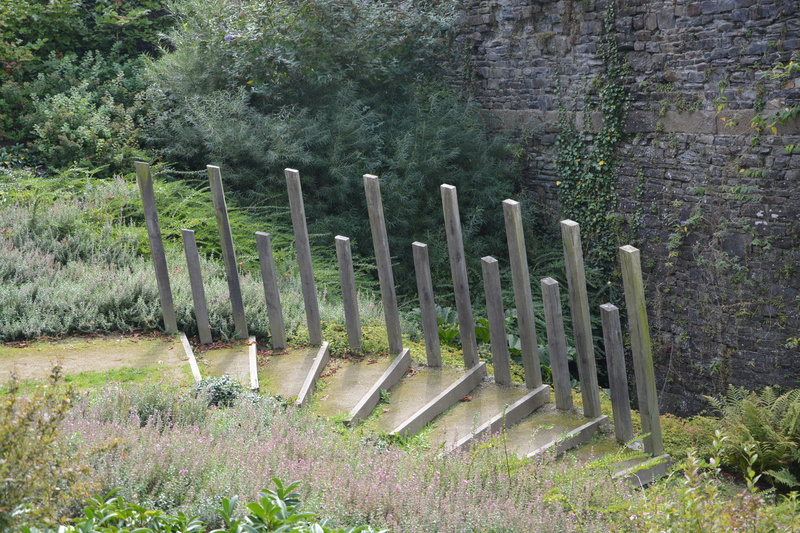 staircase, footpath, green color, built structure, grass, outdoors, growth, barrier, tranquil scene, tree, promenade, no people, jules revert dol de bretagne
