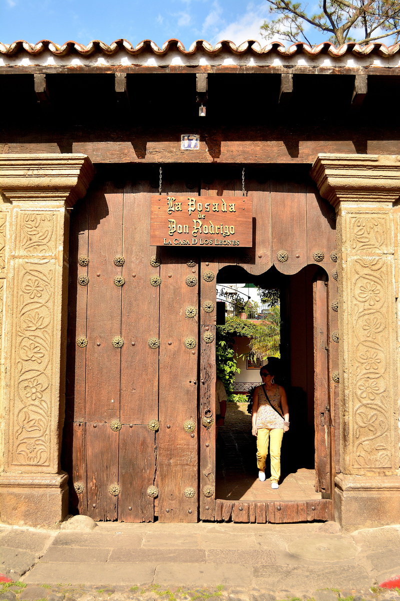 men, architecture, outdoors, 5K, women, antigua guatemala, old wood, script, day, text, real people, wooden door, non-western script, building exterior