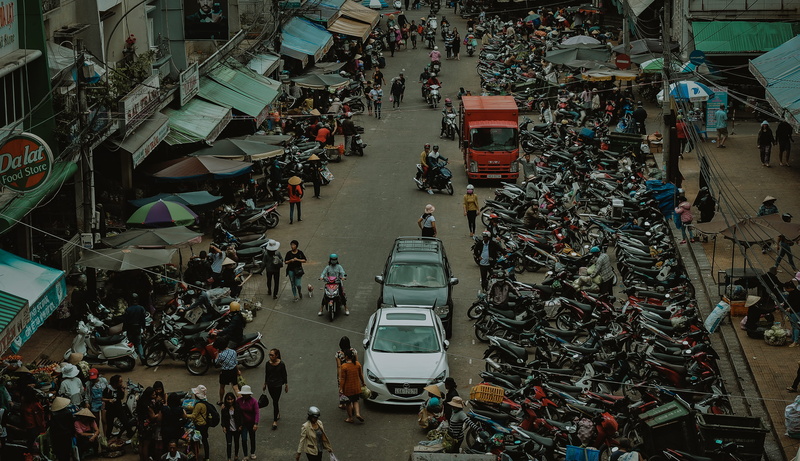 built structure, outdoors, transportation, high angle view, market stall, mode of transportation, street, incidental people, road, women, people, business