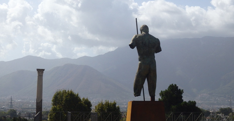 tree, male likeness, sculpture, travel destinations, sky, nature, monument, architecture, human representation, day, vesuvies, art and craft, pompeii, creativity