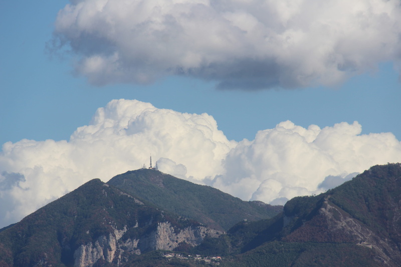 clouds, tranquility, idyllic, mountain range, nature, environment, day, non-urban scene, italy, low angle view, sky, outdoors, mountains, physical geography