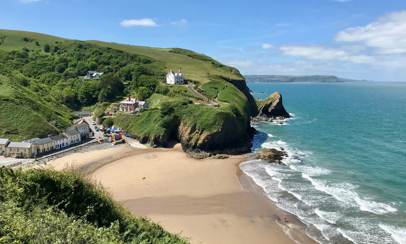 seaside, white house, horizon over water, cloud - sky, sand, sky, outdoor, horizon, idyllic, scenics - nature, landscape, nature, water, rock, day, cliff