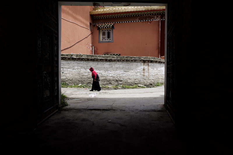 road, architecture, alleyway, alley road, adult, female, leisure activity, real people, 4K, outdoors, side view, brick, standing, red, garze, tagong, one person
