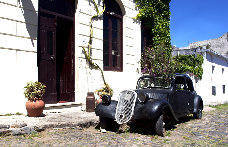 nature, transportation, wheel, plant, mode of transportation, architecture, building exterior, house, scooter, sunlight, no people, building, uruguay, city