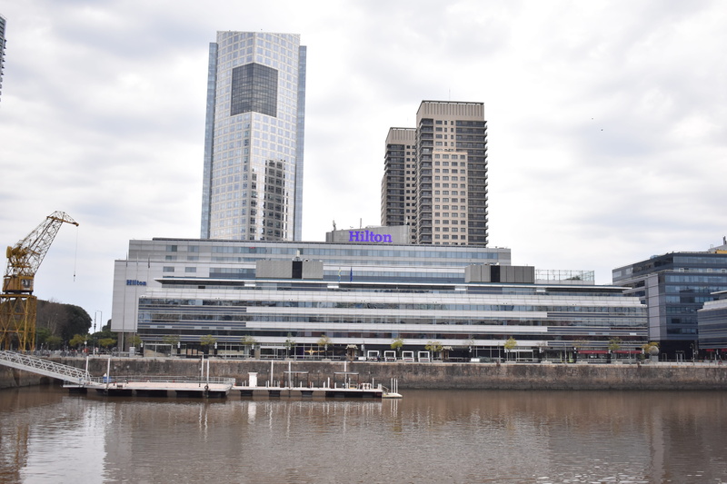 waterfront, reflection, outdoors, hotels, horizon, boat, no people, nature, architecture, city, building, port, day, tall - high, spring, modern, cloud - sky