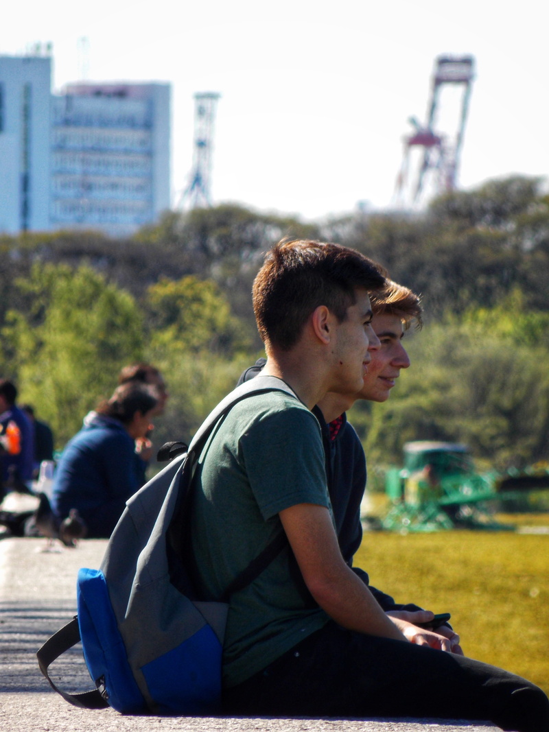 city, puerto madero, outdoors, real people, glasses, one person, incidental people, single, young adult, building exterior, argentina, architecture, sitting