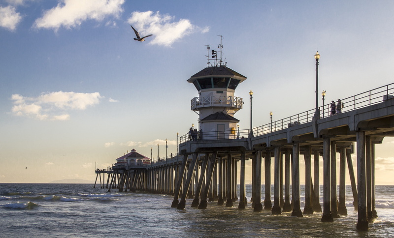ocean, beach, lighthouse, architecture, outdoors, tower, sky, no people, Huntington Beach, day, built structure, american, sunny, huntington beach, sea