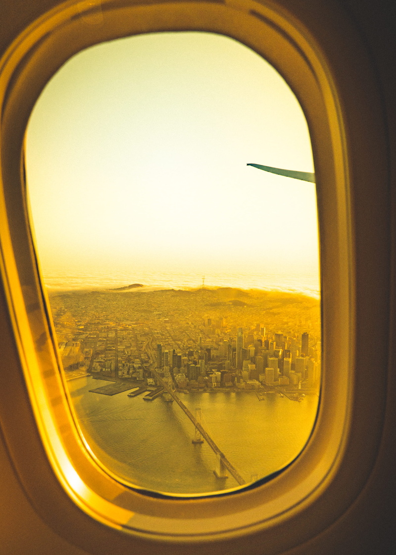 clouds, window, landscape, sky, outdoors, drone, cityscape, no people, earth, sunset, aerial, buildings, view, glass - material, plane, building exterior