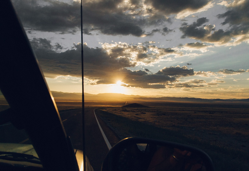 no people, beauty in nature, adventure, landscape, land vehicle, road trip, lonely, cloud - sky, sky, road, united states, sunlight, glass - material, outdoors