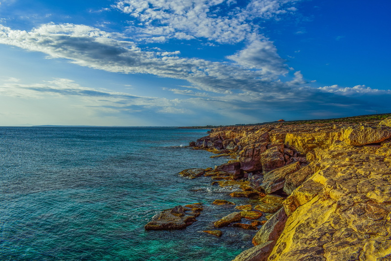 scenics, rock formation, tranquil scene, blue, national park, land, cliff, clouds, beach, eroded, outdoors, shore, cloud - sky, erosion, cavo greko, horizon over water