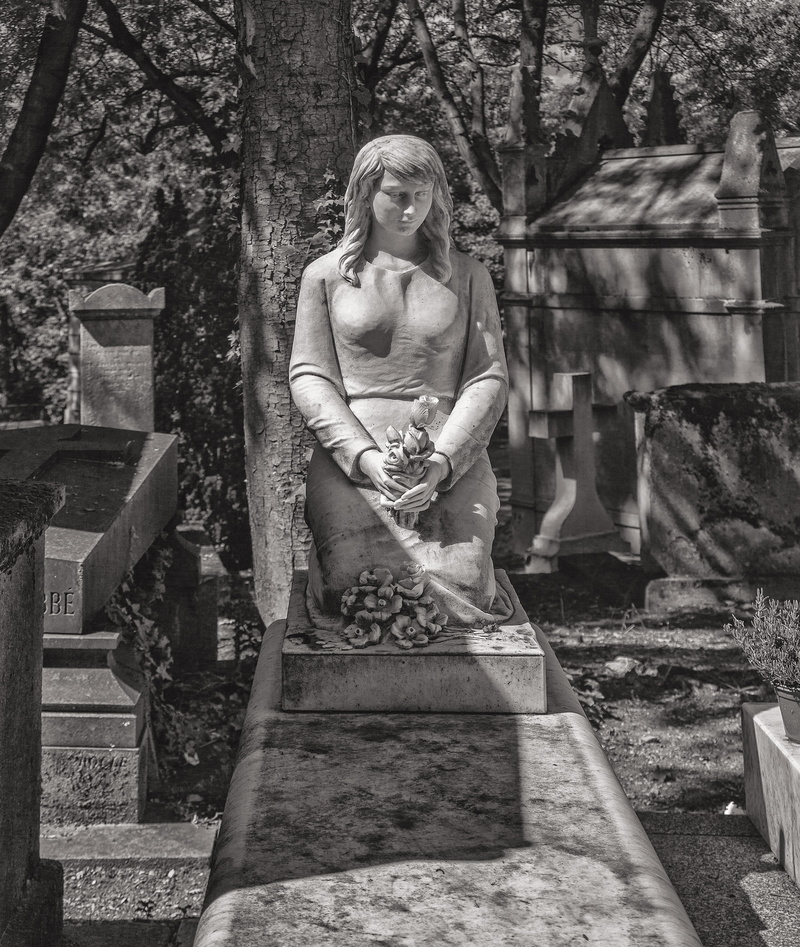 grave, flounder, halibut, art, sculpture, one person, sitting, young women, day, real people, cross, person, outdoors, fish, emotion, figurine, casual clothing