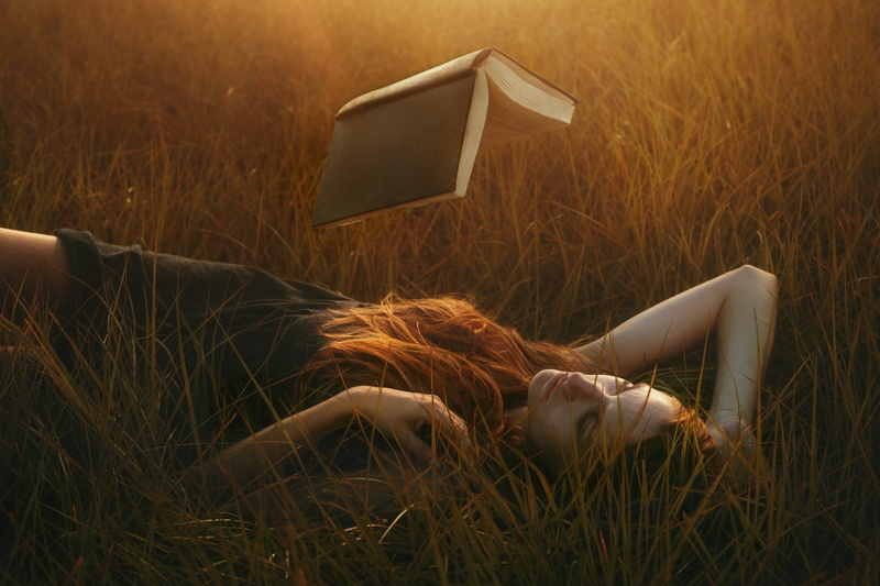 nature, long hair, redhead, grass, sunlight, field, model, photo manipulation, women, women outdoors, books, magic, black dress, lying on back, reading