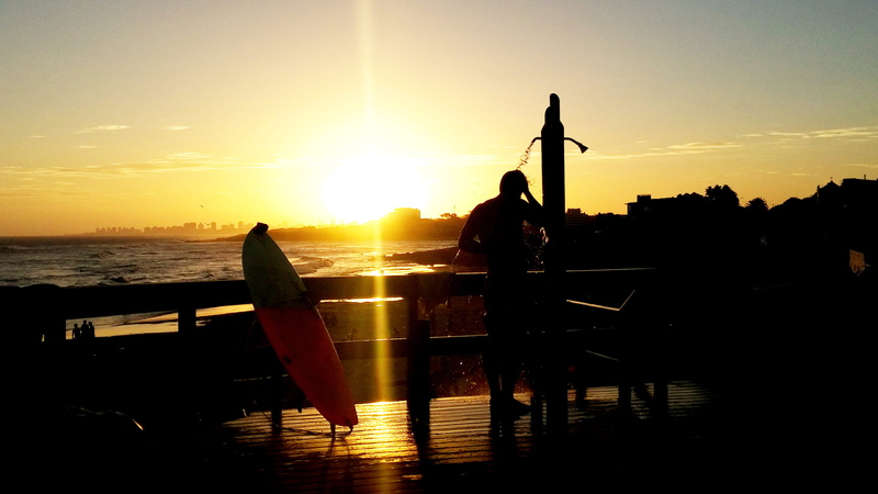 surfer, shore, swimming pool, relaxation, one person, shower, people, sky, lifestyles, reflection, orange color, dusk, real people, beach, near, water