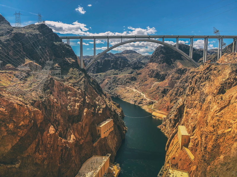 connection, view, travel destinations, mountain, bridge - man made structure, outdoors, cliff, nature, landscape, daytime, valley, building, arch bridge