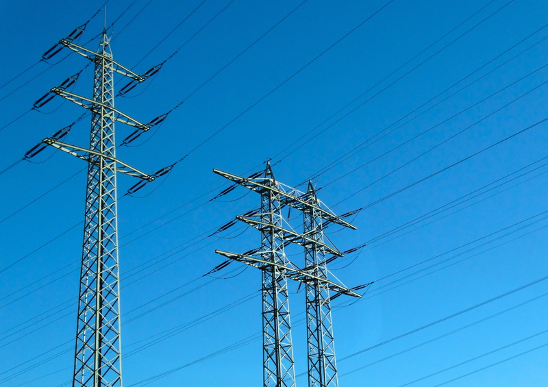 no people, clear sky, outdoors, power line, nature, low angle view, power supply, tall - high, built structure, current conducting, technology, strommast