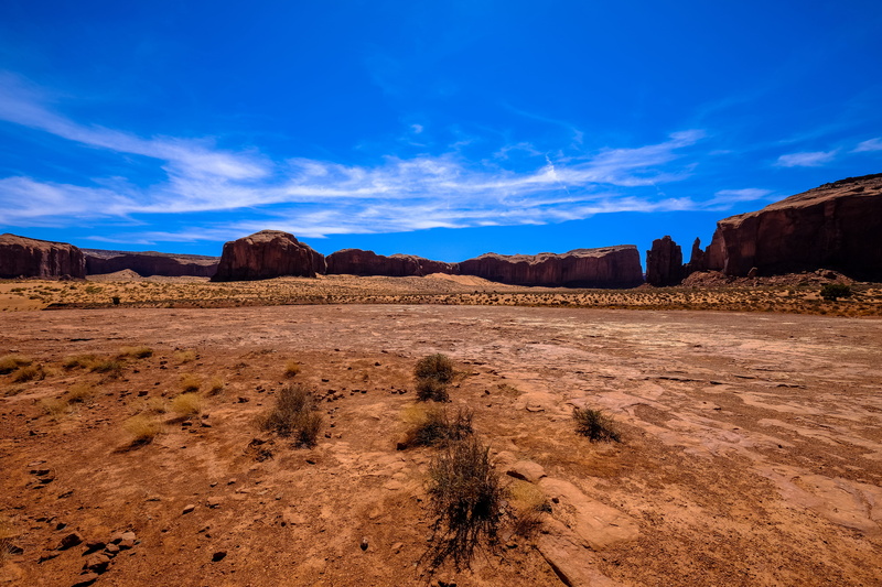 highway, landscape, non-urban scene, soil, brown, cloud - sky, climate, rock formation, sandstone, environment, dirt road, grass, eroded, tranquil scene